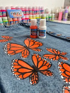 the table is covered with many different colored paints