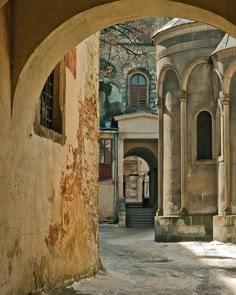 an archway leading into a building with arches