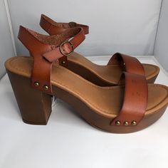 Falls Creek Brogan Cognac Platforms Woman's Size 10 Medium Nwt Nib Sandals Brown Heels. Women’s Casual Shoes. Some Black Marks On Right Shoe. New In Box. New With Tags. From Smoke Free Home. Retro Leather Open Toe Mules, Retro Brown Platform Heels, Brown Stacked Heel Summer Heels, Summer Brown Heels With Stacked Heel, Vintage Brown Mules For Summer, Summer Brown Stacked Heel Heels, Vintage Sandals With Block Heel For Spring, Vintage Block Heel Sandals For Spring, Vintage Summer Clogs With Round Toe