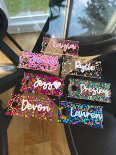 the name tags are all different colors and designs