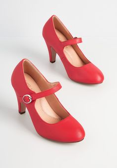 Rock around the clock with these red Mary Jane pumps. These vintage-inspired heels feature a smooth faux-leather finish in a vibrant crimson hue. The classic rounded toe, modest heel, and Mary Jane strap take authentic steps into the fashion of the 1950s. Man-made materials. Imported Heel measures 3.25 inches. Adjustable straps. | ModCloth Kickin' Up Feels Mary Jane Heels in Red, Size 10 Spring Heels, Glamour Vintage, Dr Shoes, High Heels Boots, Watch Trends, T Strap Heels, Mary Jane Pumps, Red High, Red Heels