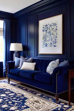 a living room with dark blue walls and rugs on the floor in front of it