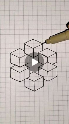 a pen is drawing an image on a piece of paper with squares and cubes