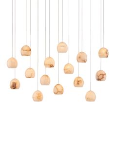 a group of wooden balls hanging from strings