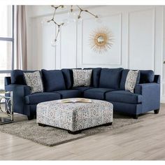 a living room with a blue couch and ottoman