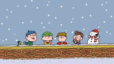 the peanuts gang are making snowmen look like they're going to build a snowman