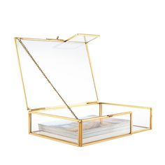 an open glass box with a chain hanging from the bottom, on a white background