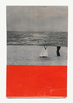 two people walking on the beach with an orange and red border around them, in front of water