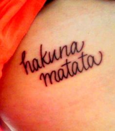 a woman with a tattoo on her thigh that reads, hakuna matato