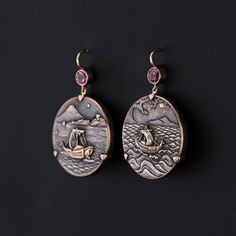 Shakudo is a Japanese mixed metal technique that involved an alloy of copper and gold that was treated to give it a dark black patina. These extraordinary earrings were converted from a pair of antique mixed metal cufflinks (circa 1890-1900). Our jeweler mounted the shakudo pieces in 14k gold and added pink tourmaline surmounts. Each earring measures 1.55 inches from the top of the ear wire to bottom by 1 inch wide. They are in great condition. Materials: 14k gold, Tourmaline. Luxury Collectible Bronze Jewelry, Antique Finish Copper Round Jewelry, Antique Finish Copper Jewelry, Elegant Ceremonial Earrings With Oxidized Finish, Bronze Antique Finish Drop Earrings, Elegant Oxidized Earrings For Ceremonial Occasion, Artisan Rose Gold Metal Jewelry, Unique Rose Gold Metal Earrings, Elegant Engraved Metal Earrings