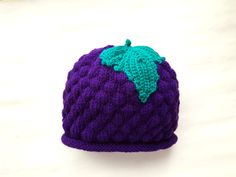 This purple grape hat is completely hand made in Sweden using high-quality yarns. It is a great winter accessory as well as a super cute birthday present.  We especially preferred to work with acrylic for this hat as acrylic is synthetic and will not irritate someone who has sensitivity to wool or animal-based products.  Acrylic headwear keeps its shape, holds its color, and is resistant to stains and wrinkles. You can put this hat to washer in sensitive program. We offer different sizes, please Cute Purple Beanie Hat, Purple Hat As A Gift, Purple Hats As Gifts, Hand Knitted Purple Hat One Size, Hand Knitted One Size Purple Hats, Hand Knitted Purple Hat, Hand-knitted One Size Purple Hat, Purple Cap As A Gift, Hand Knitted Purple Yarn Hats