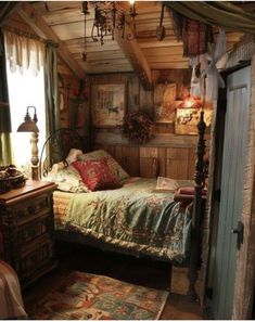 a bedroom with a bed, rugs and lamps on the ceiling is decorated in rustic style