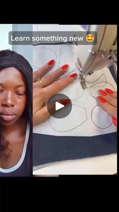 a woman with long black hair and red nails is cutting out the pattern on a piece of fabric