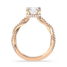 a rose gold engagement ring with an oval cut diamond center and pave set shoulders