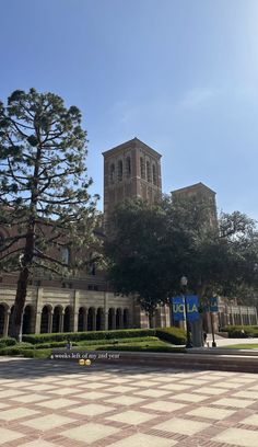 a large building with a clock tower in the background