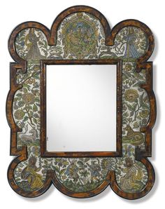 a mirror with an ornate design on it