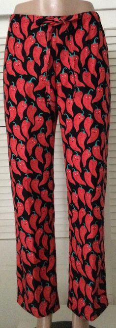 "Chili peppers on black background /flannel pajama pants for women  100% cotton flannel pajama pant with adjustable waistband.  Drawstrings are sewn to 1/2\" non-roll elastic which are inserted into waistband casing through buttonholes in front of pant.  Top of waistband rests about 1\" below natural waist. Styling is considered low-rise Sizing for Women:  XS(2-4), S(4-6), M(8-10), L(12-14) Sizing allows for 3-4 inches of ease All seams are sewn with a serger except for  topstitching on drawstri Pant Top, Pajamas Pants, Warm Pajamas, Flannel Pajama Pants, Pajama Pant, Flannel Pajamas, Sleep Shorts, Chili Peppers, How To Get Warm