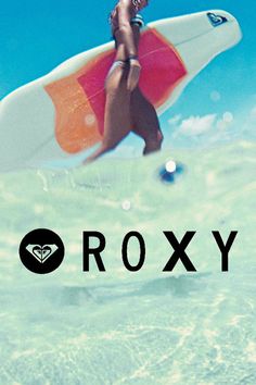 a woman in the water holding a surfboard with the word roxy above her head