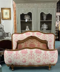 an old fashioned couch is on display in a store