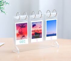 two clear acrylic photo holders with photos on them, each containing the word mar