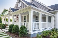 a white house with porches and steps leading to it