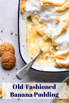 an old - fashioned banana pudding in a bowl with a spoon and cookie on the side