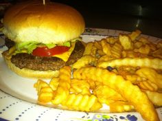 a hamburger and french fries on a plate