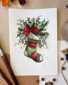 a watercolor painting of a christmas stocking