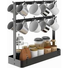 a rack with pots and pans hanging from it's sides on a white background