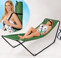 a woman in a bathing suit sitting on a lawn chair