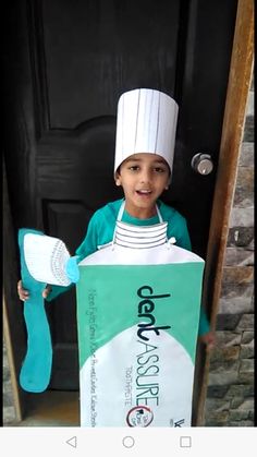 a young boy dressed up as a chef