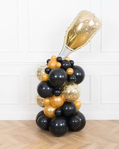 new-years-decorations-balloon-column-champagne-chicago-2023-gold-black-paris312 Pouring Champagne, Champagne Balloon, Gold Champagne Bottle, Champagne Balloons, Balloon Pop, 65th Birthday, Balloon Centerpieces, Gold Champagne, Space Place