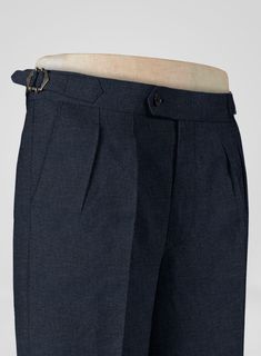 Secure an iconic styling with signature accents by pairing it with our Italian Prato Dark Blue Dobby Linen Trousers. Besides, the Trousers are crafted from a pure linen fabric, which provides a flexible, tenacious nature while including a gratifying smoothness with a solid finish over blue hues. Finally, make your wardrobe stand out with beautifully cut and designed quirky details for a trendy look that will feel comfortable for work, casual, or special occasions.  
 
 Look Includes  Italian Pra Fitted Denim Blue Pants With Welt Pockets, Classic Denim Blue Bottoms With Welt Pockets, Elegant Denim Blue Bottoms With Pockets, Fitted Denim Blue Bottoms With Welt Pockets, Fitted Denim Bottoms With Welt Pockets, Fitted Denim Blue Bottoms For Business Casual, Classic Denim Blue Pants With Welt Pockets, Tailored Linen Pants With Pockets, Formal Linen Bottoms With Pockets