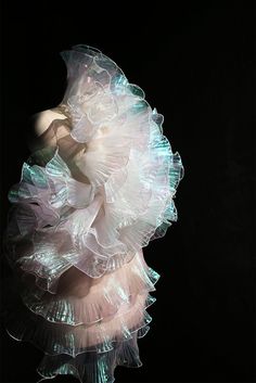 an abstract photograph of a woman in white dress