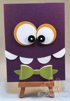 a purple card with eyes and a bow tie