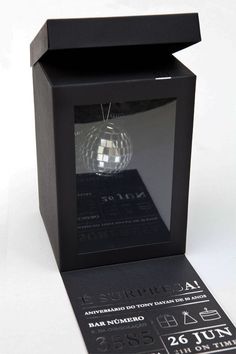 a black box with a glass ball in it