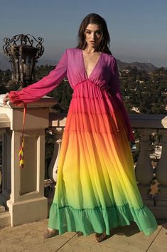 This tiered rainbow maxi dress features a flattering V-neckline, a stunning gradation of colors, and intricate pleated details. The dress also includes tassel detailing on the sleeves, adding a playful touch to this captivating ensemble. Long sleeves has lining No closure Self & Lining: 100% Polyester Hand wash cold Model is wearing a small See Sizes in Size Chart Layered Gown, Trendy Outfit Ideas, Casual Beach Wear, Fashion Illustrations Techniques, Ombre Dress, Rainbow Fashion, Fall Outfit Ideas, Rainbow Dress, Dress Halter