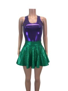 a female mannequin wearing a green and purple skirt