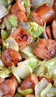 sausage, cabbage and onions are mixed together in a bowl for an easy dinner or side dish