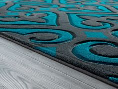 a blue and gray rug on the floor