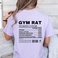 "Introducing our \"Gym Rat Nutrition Fact'' shirt--a funny and stylish addition to your gym wardrobe.This hoodie is packed with humor, featuring a playful \"nutrition label\" that proudly declares some gymrats characteristics. HOW TO ORDER: 1. Choose size/color options 2. Select the quantity 3. Click \"Add to Cart\" 4. Proceed to payment COMFORT COLOR SHIRT FEATURES - 100% ring-spun cotton - Medium fabric - Many range of colors available - Relaxed fit - sewn-in twill label SIZING: While these T shirts are unisex and run true to size, we would recommend sizing up 1-2 sizes for an oversized look! CARE INSTRUCTIONS: - Machine wash cold, inside out - Hang dry or tumble dry low - Do not bleach or iron directly on design PROCESSING AND SHIPPING: 3-5 business days for processing Allow 5-7 busines Funny Letter Print Gym Tops, Sporty Tops With Funny Text For Workout, Short Sleeve Gym Top With Funny Text, Sporty Workout Tops With Funny Text, Relaxed Fit Slogan Top For The Gym, Funny Text Short Sleeve Gym Tops, Funny Gym Tops With Crew Neck, Funny Crew Neck Gym Tops, Funny Text Crew Neck Top For Gym