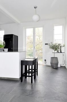 the kitchen is clean and ready to be used as a living room or dining area