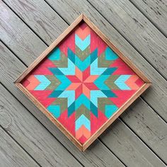 a wooden box with a colorful pattern on it