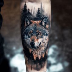 a man's leg with a wolf tattoo on it and trees in the background