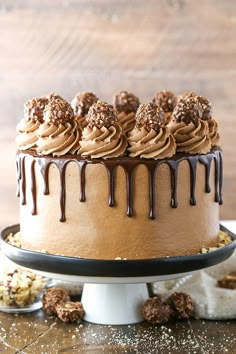 a cake with chocolate frosting and cookies on top