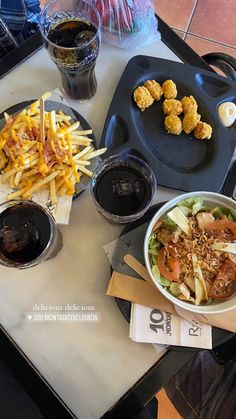 a table topped with plates of food and drinks