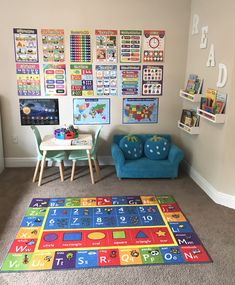 a child's playroom with toys and posters on the wall, including a blue chair