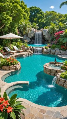 an outdoor swimming pool surrounded by tropical plants and flowers, with a waterfall in the middle