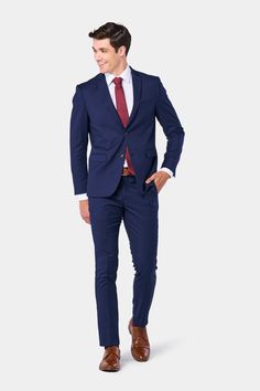 Modern Navy Blue 2 Button Suits Starting At $199 - Mensuits.com Navy Blue Suit Tie Combination, Blue Suit Red Tie, Blue Suit Brown Shoes, Deep Blue Suit, Navy Groomsmen Suits, Colored Suits, Tan Brown Shoes, Blue Three Piece Suit, Long Suit Jacket