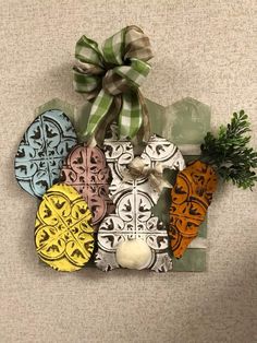 an assortment of decorative ornaments hanging on a wall